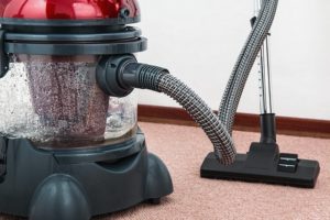 Image of a hoover on carpeted flooring